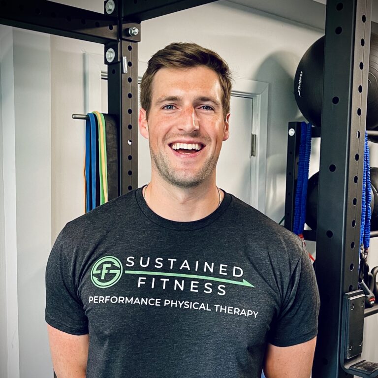 a smiling man wearing a t shirt with the words sustainable fitness.