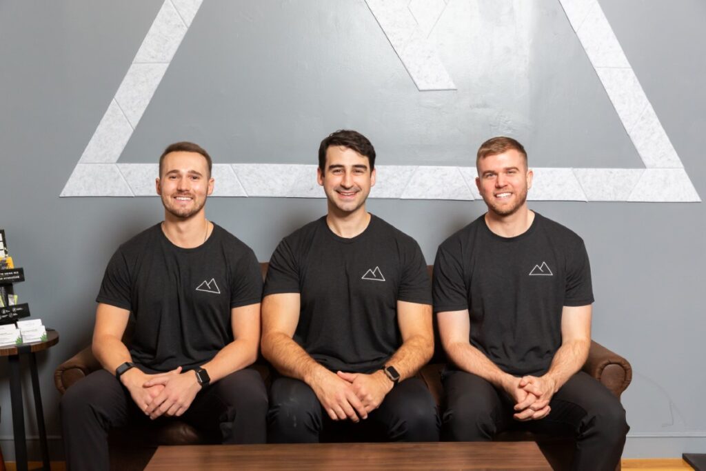 Team of physical therapists seated in clinic, representing expert care in physical therapy.